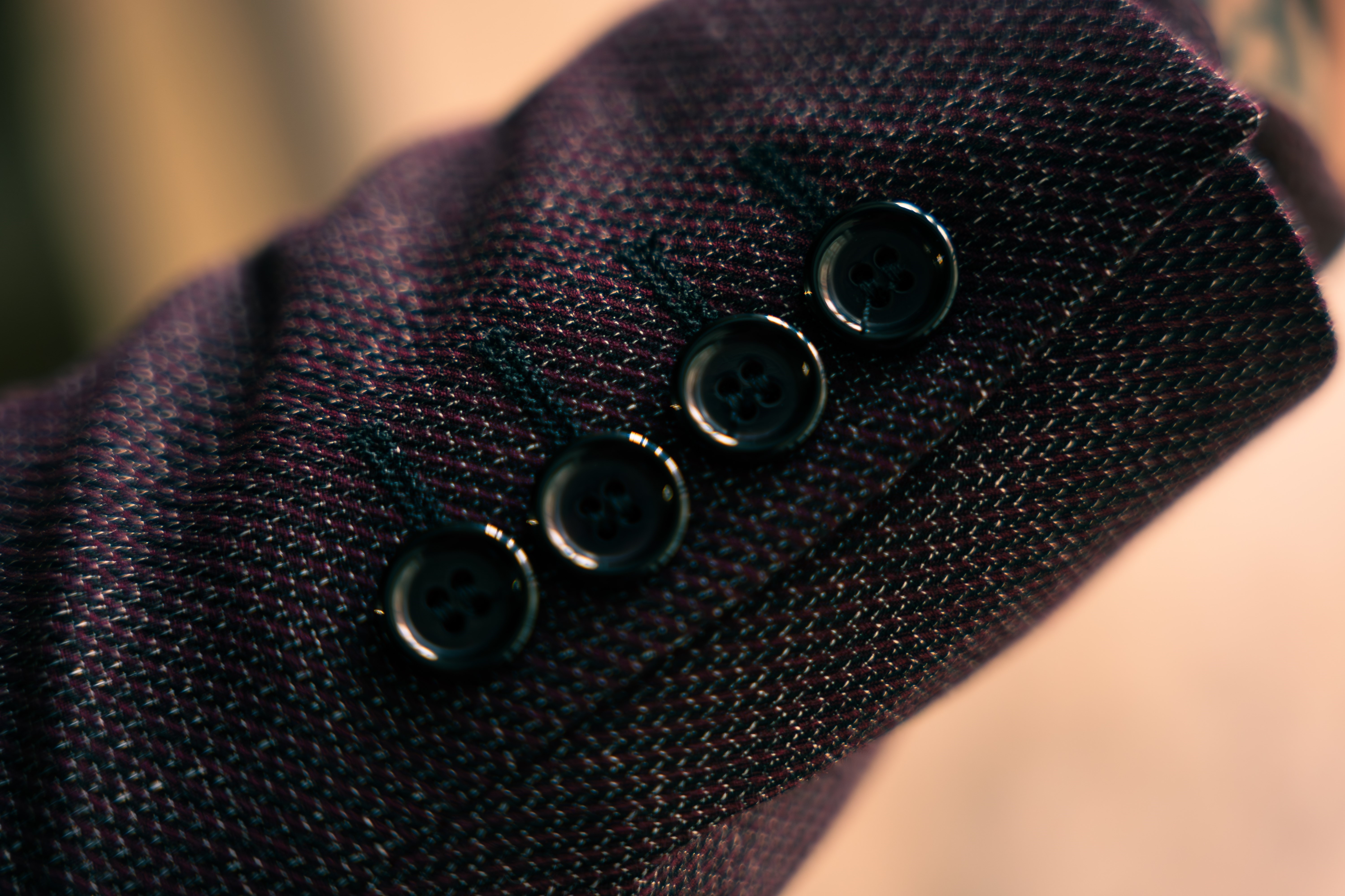 Close-up of high-quality luxury fabric texture with elegant draping in soft natural light, minimalist fashion aesthetic